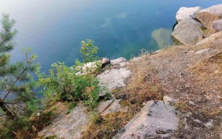 Под Киевом водолазы извлекли из карьера тело священника и его дочери