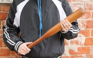 Бив битою: ДБР повідомило про підозру екс-поліцейському