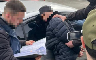 У Києві затримали начальника відділу поліції за побори зі стихійних торговців, фото