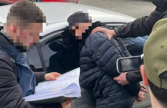 У Києві затримали начальника відділу поліції за побори зі стихійних торговців, фото