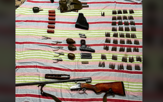 На Київщині 61-річний чоловік в себе вдома зберігав арсенал боєприпасів, фото