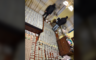 Вся комната в валюте: в Винницкой области мать с сыном наладили схему по «продаже» группы инвалидности, фото