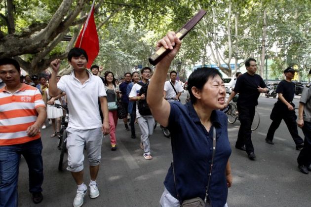 В Китае полиция застрелила 14 участников беспорядков